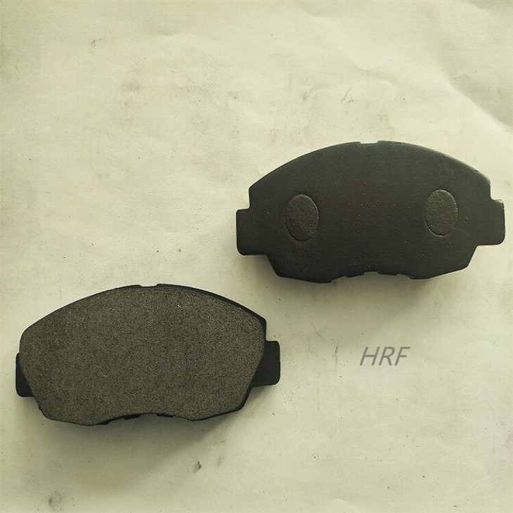 2 brake pads with black coating